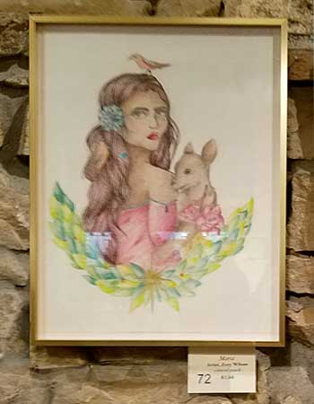 Girl holding a deer artwork
