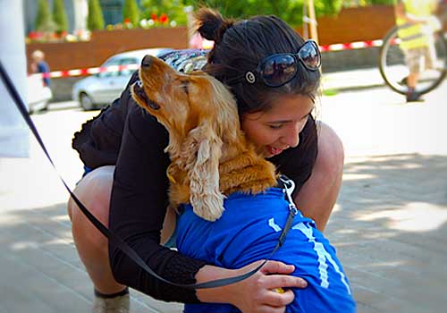 Woman hugging a Service Dog